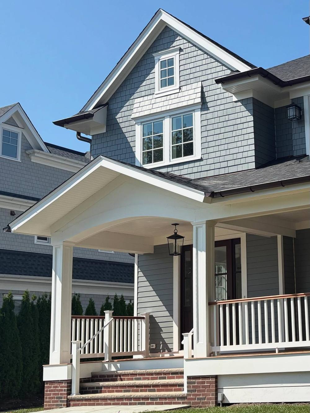 Custom shingle-style home porch detail